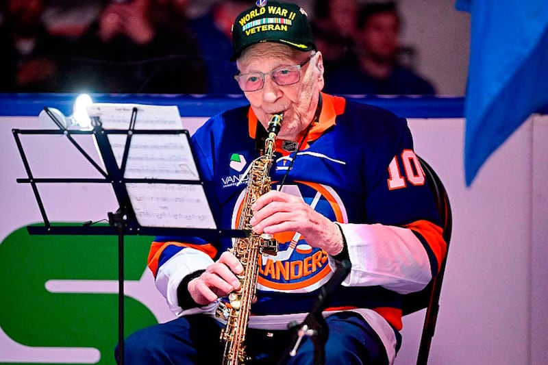 Sax appeal: WWII vet, 104, plays national anthem on saxophone before NHL game